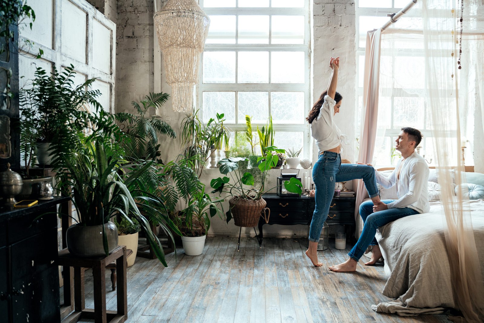 couple in a bedroom with a biophilic interior design